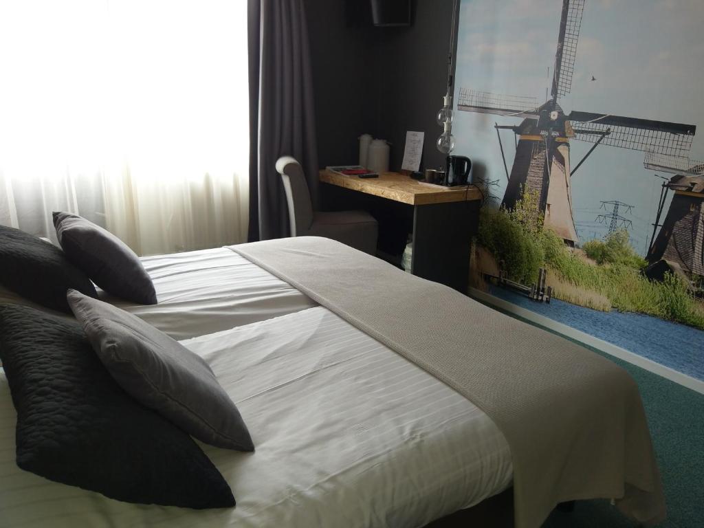 Postel nebo postele na pokoji v ubytování Hotel Villa Flora