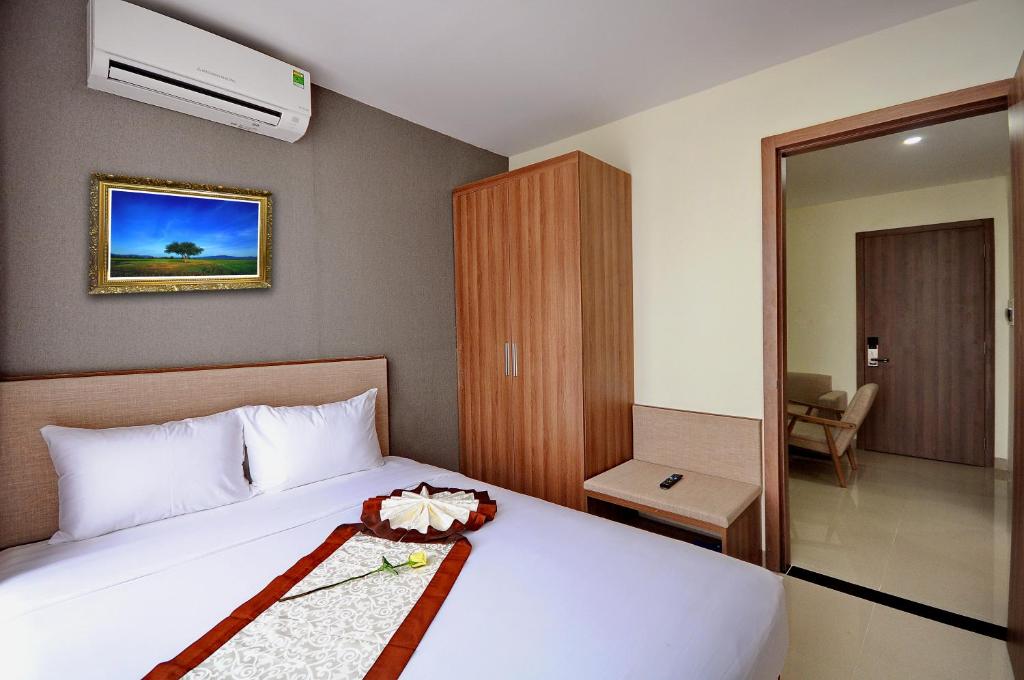 Postel nebo postele na pokoji v ubytování Rigel Hotel