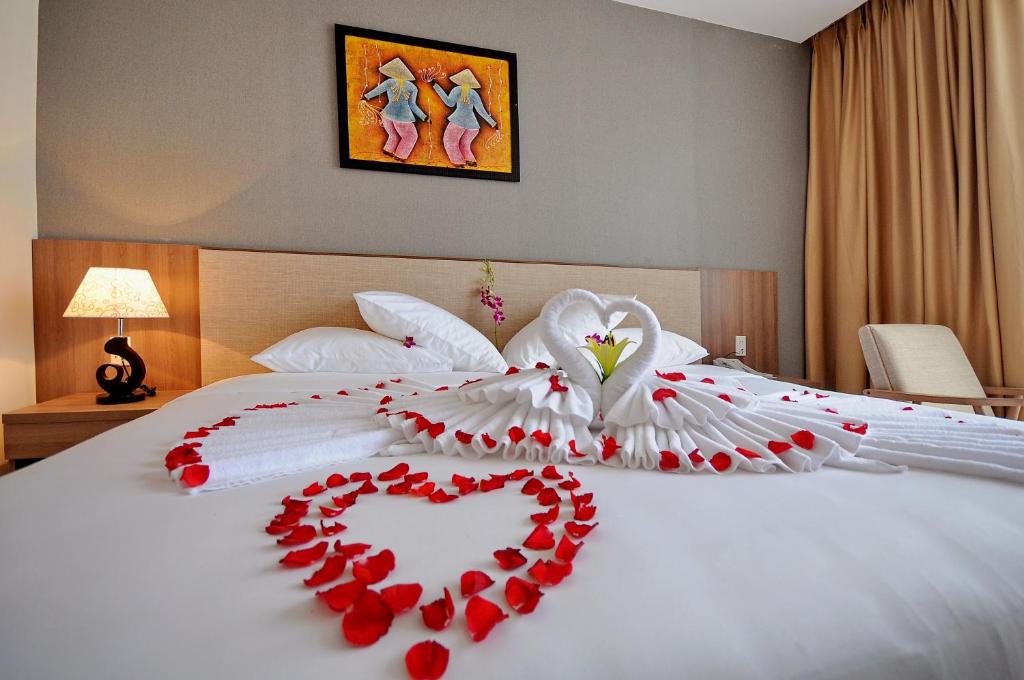 Postel nebo postele na pokoji v ubytování Rigel Hotel