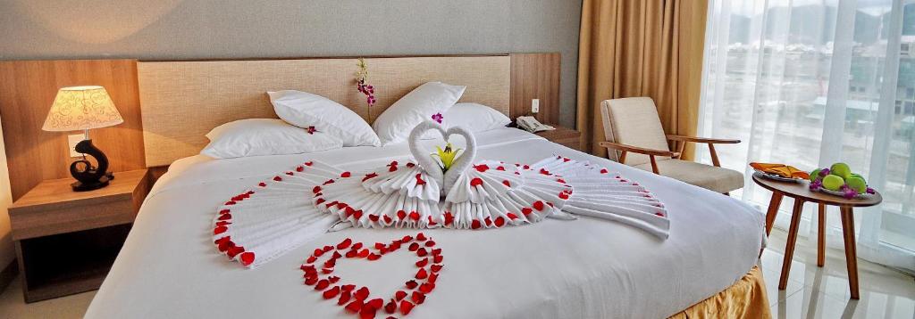 Postel nebo postele na pokoji v ubytování Rigel Hotel
