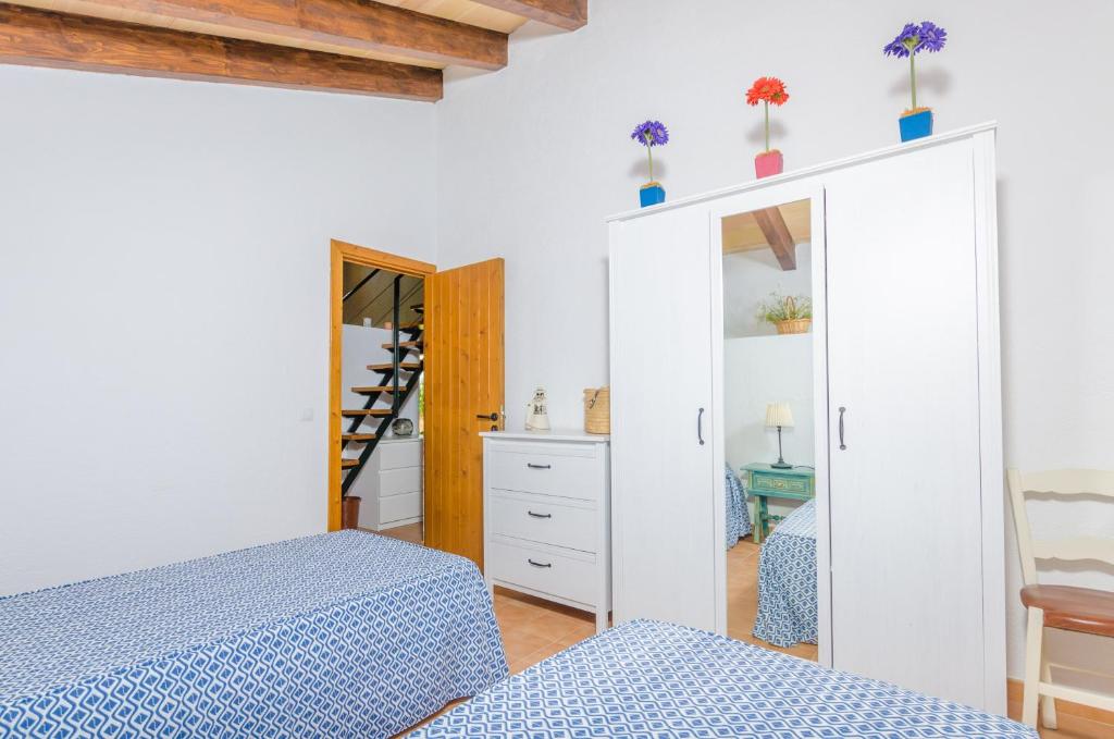 Postel nebo postele na pokoji v ubytování Son Sabater (Es Moli Nou)