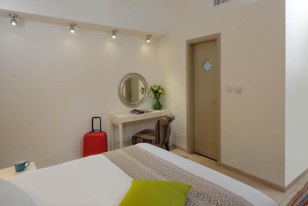 Postel nebo postele na pokoji v ubytování Rafael Residence Boutique