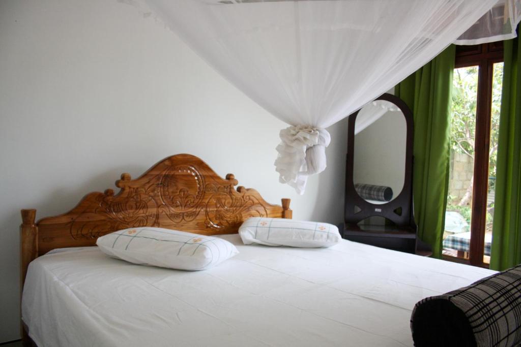Postel nebo postele na pokoji v ubytování Elegant Home Stay
