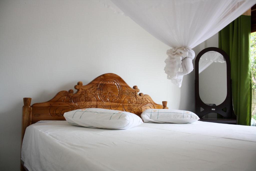 Postel nebo postele na pokoji v ubytování Elegant Home Stay