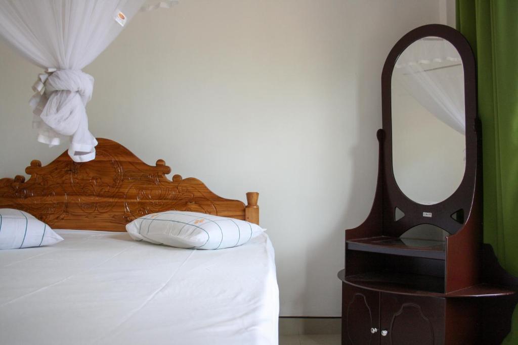 Postel nebo postele na pokoji v ubytování Elegant Home Stay