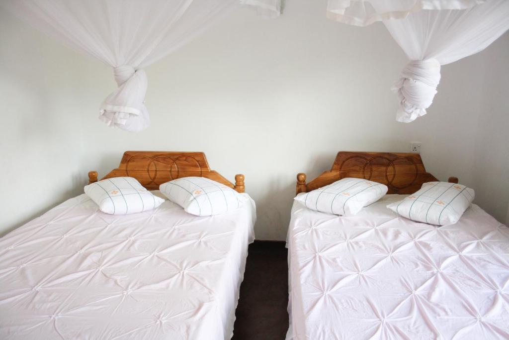 Postel nebo postele na pokoji v ubytování Elegant Home Stay