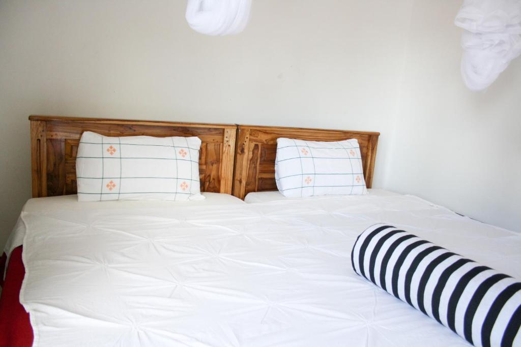 Postel nebo postele na pokoji v ubytování Elegant Home Stay