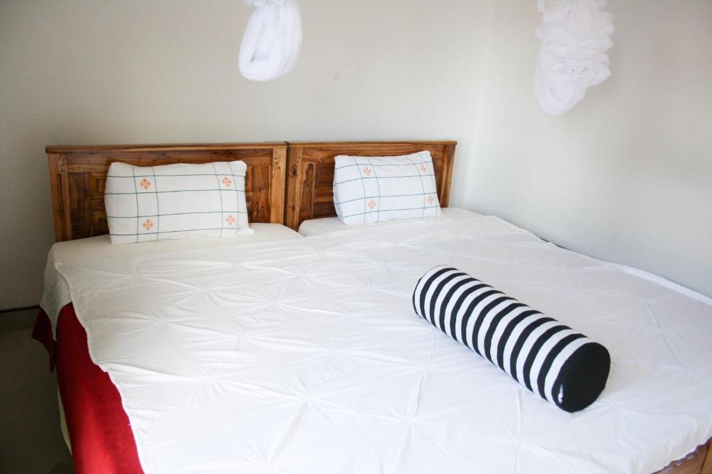 Postel nebo postele na pokoji v ubytování Elegant Home Stay