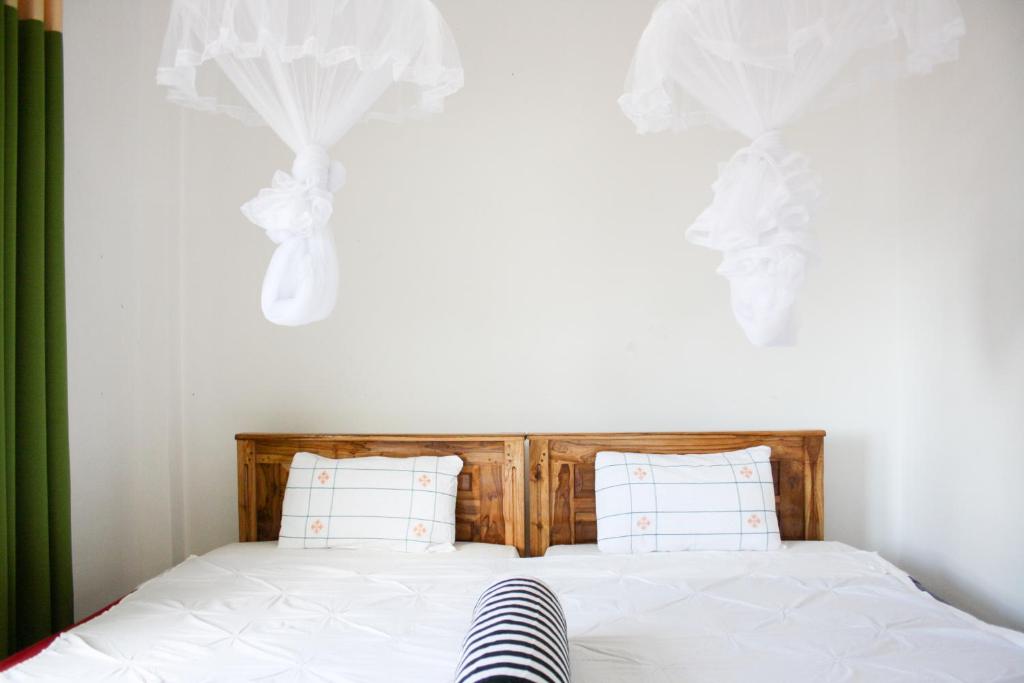 Postel nebo postele na pokoji v ubytování Elegant Home Stay