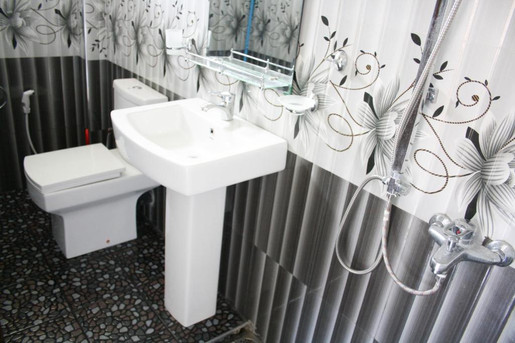 Koupelna v ubytování Elegant Home Stay