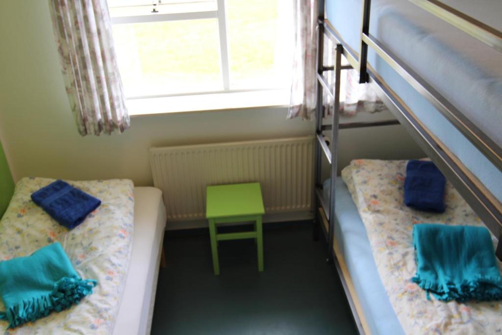 Voodi või voodid majutusasutuse Helgafell Hostel toas