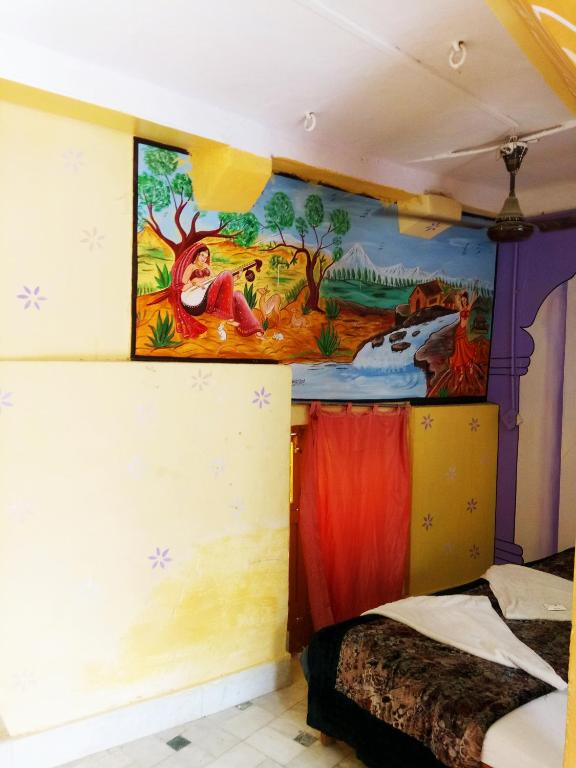 Postel nebo postele na pokoji v ubytování Hotel Paradise