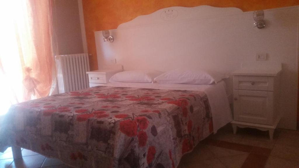 Postel nebo postele na pokoji v ubytování Il Rifugio di Dante