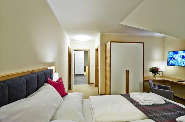 Postel nebo postele na pokoji v ubytování R&R Residenzen Aparthotel
