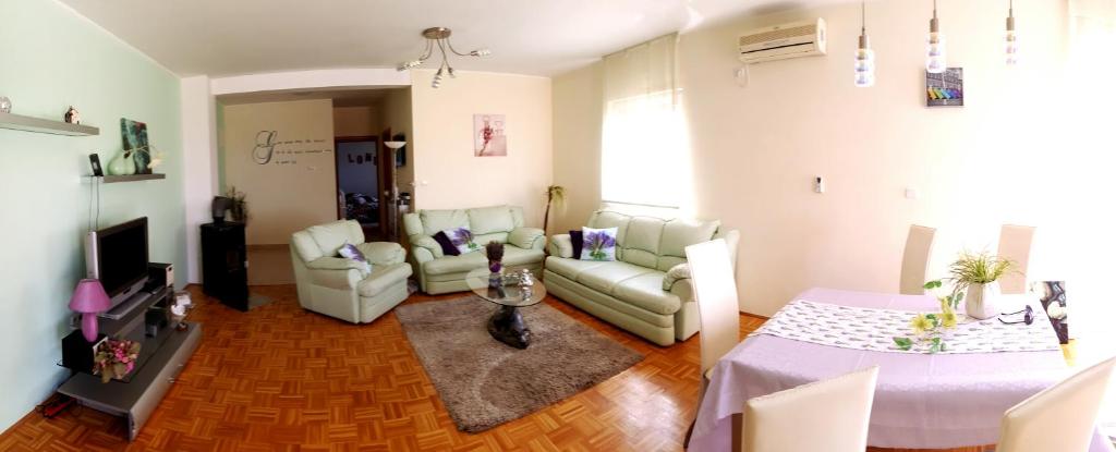 a living room with a couch and a table at Apartment Nano in Šibenik