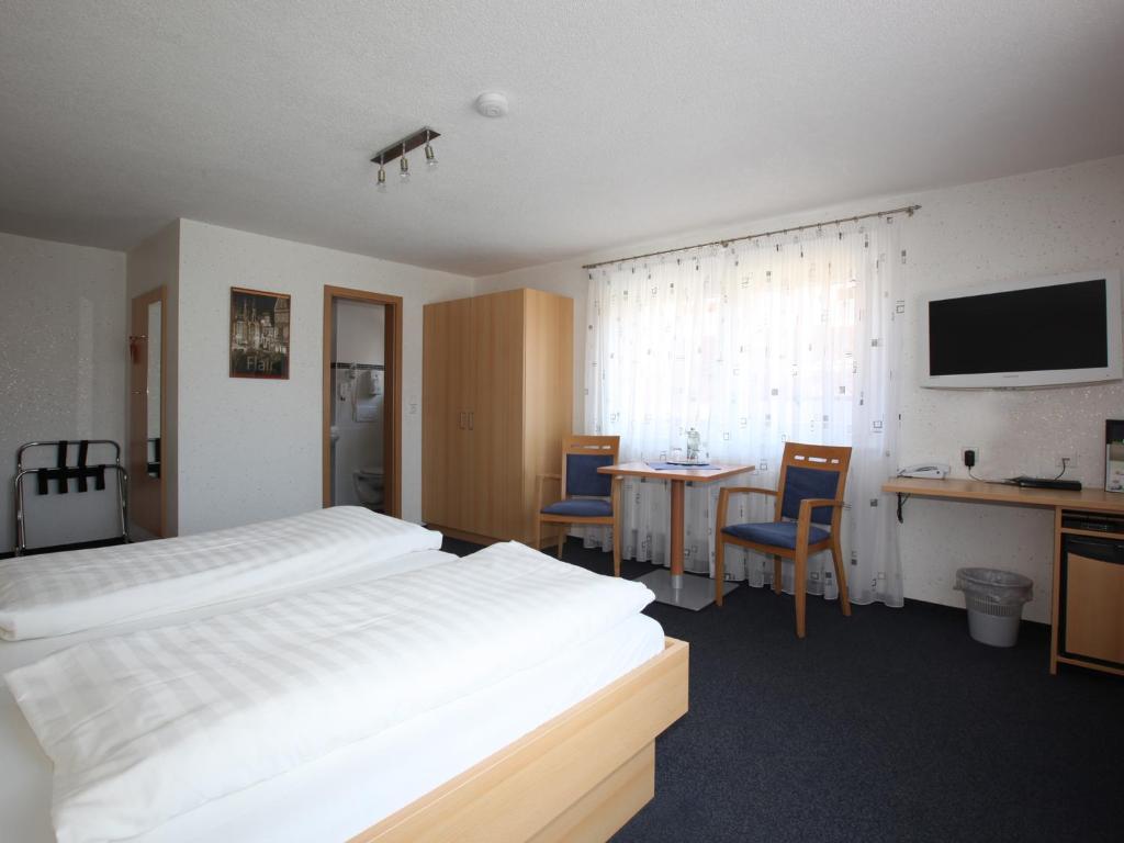 Postel nebo postele na pokoji v ubytování Hotel Klosterbräustuben