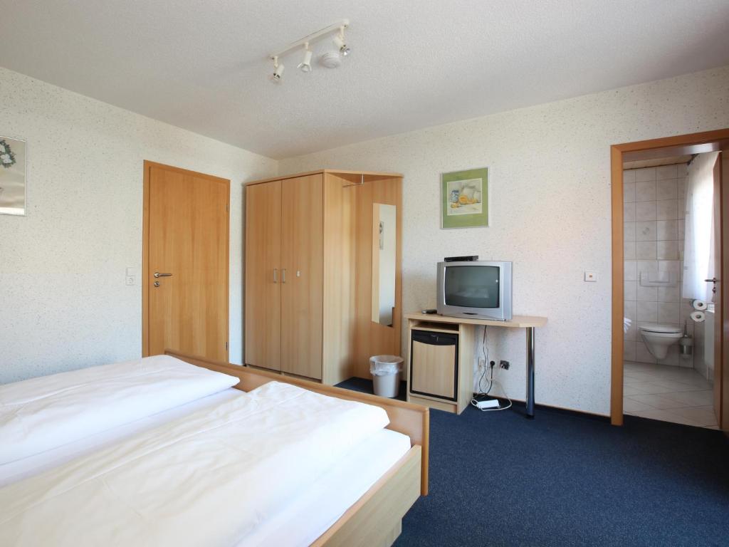Postel nebo postele na pokoji v ubytování Hotel Klosterbräustuben