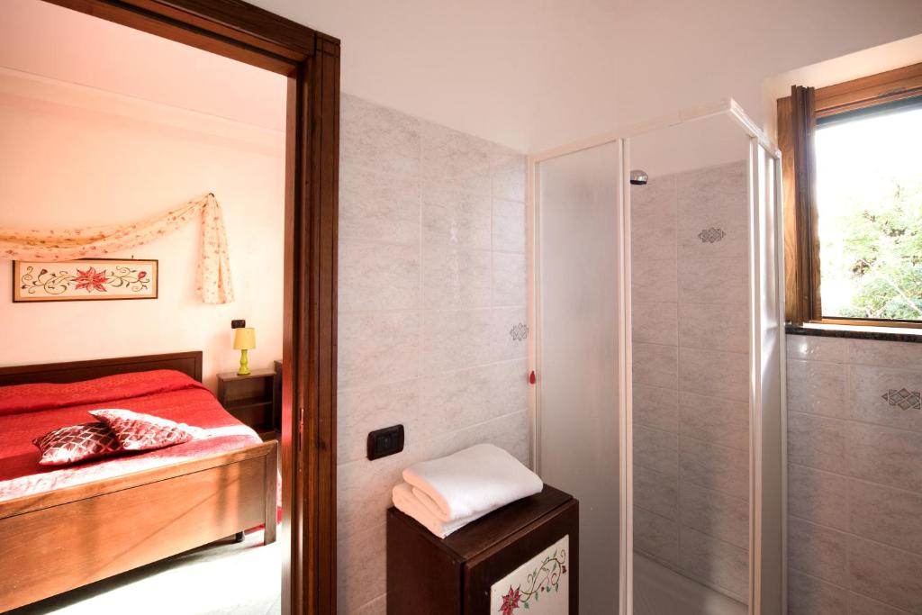 A bed or beds in a room at H.H.Le Palme