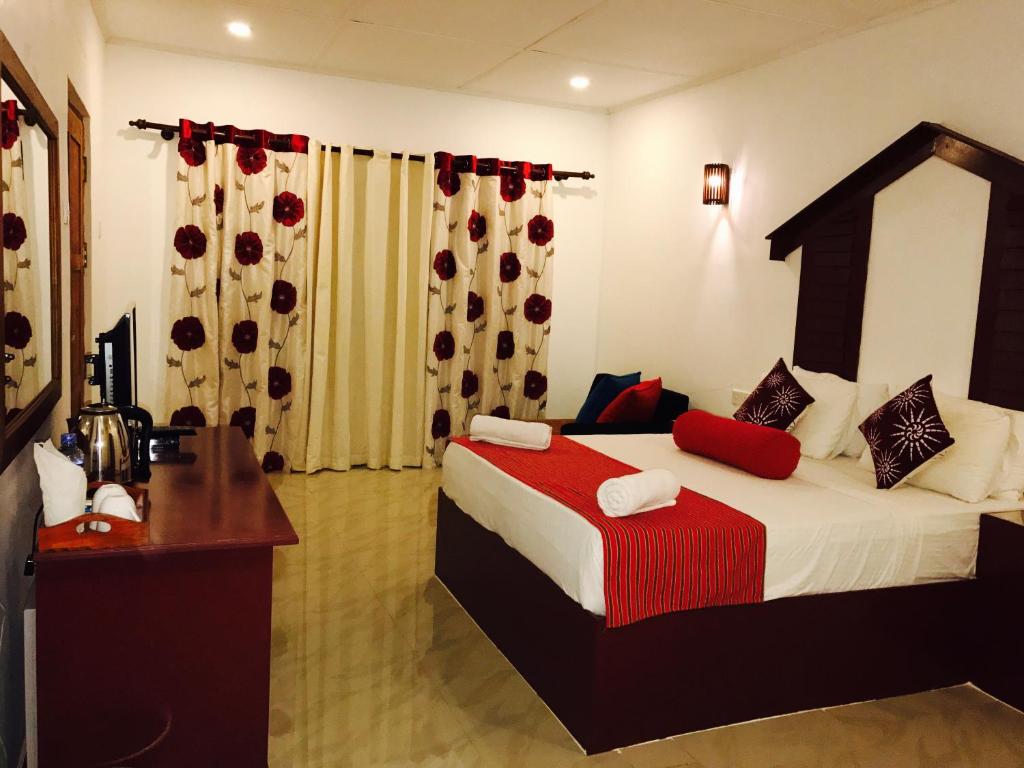 Postel nebo postele na pokoji v ubytování Sunshine Resort & Spa Sigiriya