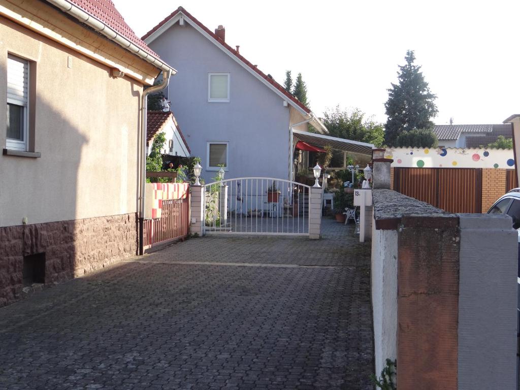 a brick driveway with a gate in front of a house at Apartment Gerda in Dieburg
