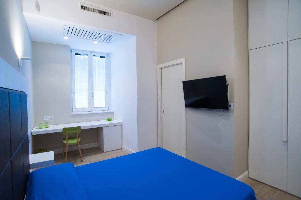 Televízia a/alebo spoločenská miestnosť v ubytovaní B & B REGINA MARGHERITA