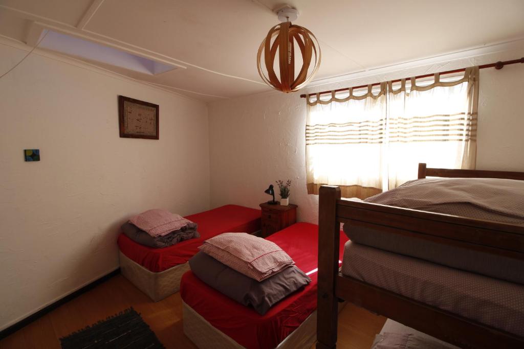 Postel nebo postele na pokoji v ubytování Backpacker's Hostel Iquique