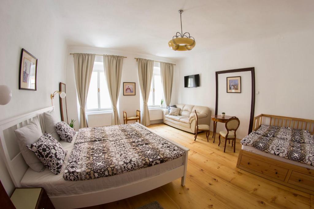 Postel nebo postele na pokoji v ubytování B&B Krumlov