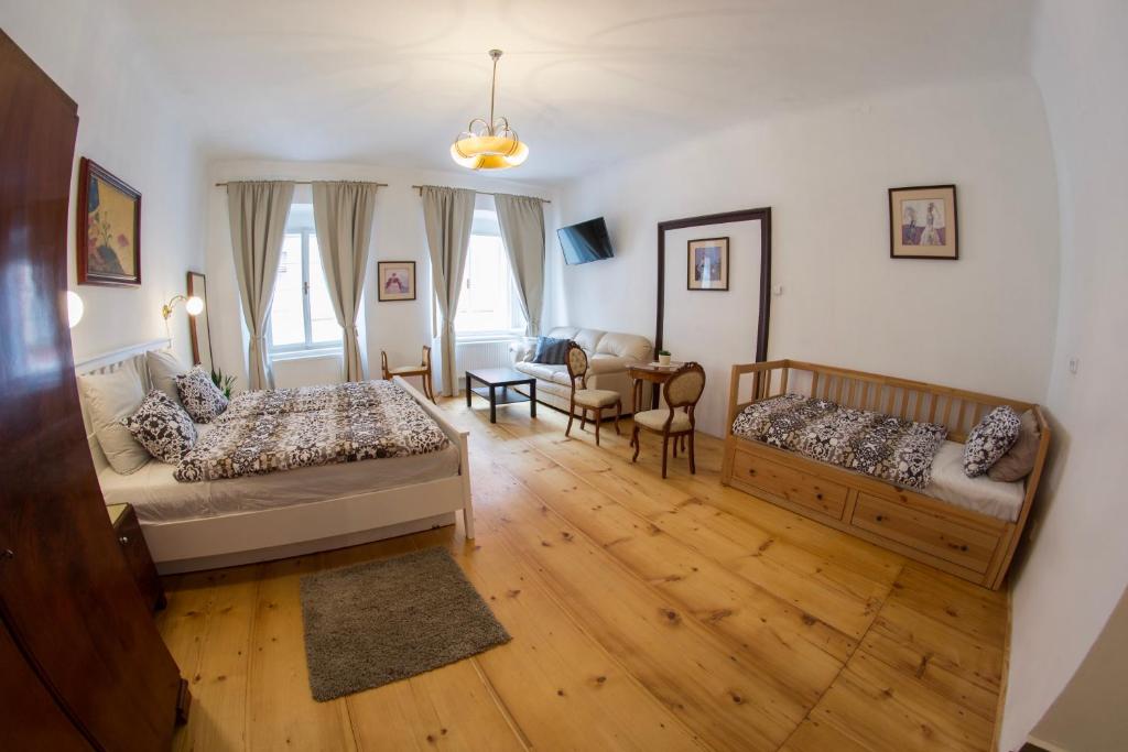 Postel nebo postele na pokoji v ubytování B&B Krumlov