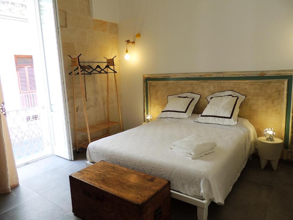 Postel nebo postele na pokoji v ubytování Le Luminarie B&B