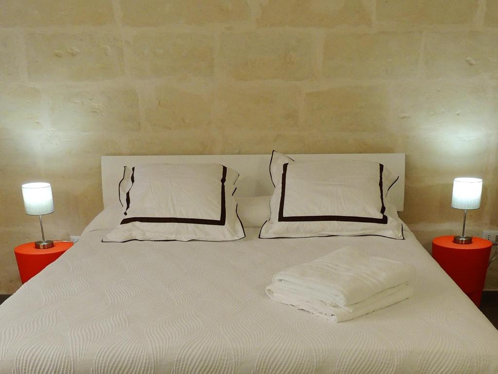 Postel nebo postele na pokoji v ubytování Le Luminarie B&B