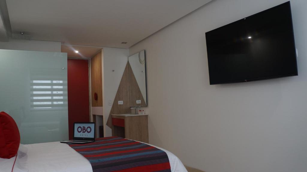 TV a/nebo společenská místnost v ubytování Obo Hotel