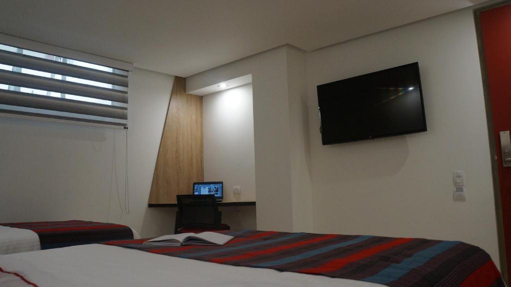 TV a/nebo společenská místnost v ubytování Obo Hotel