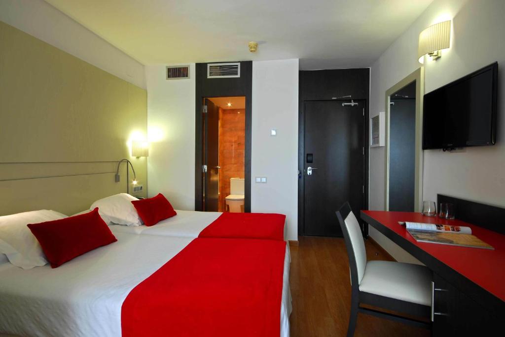 Postel nebo postele na pokoji v ubytování Grupotel Gravina