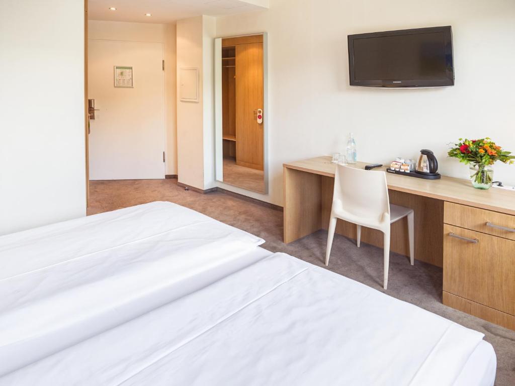 Postel nebo postele na pokoji v ubytování Hotel Berlin Mitte by Campanile