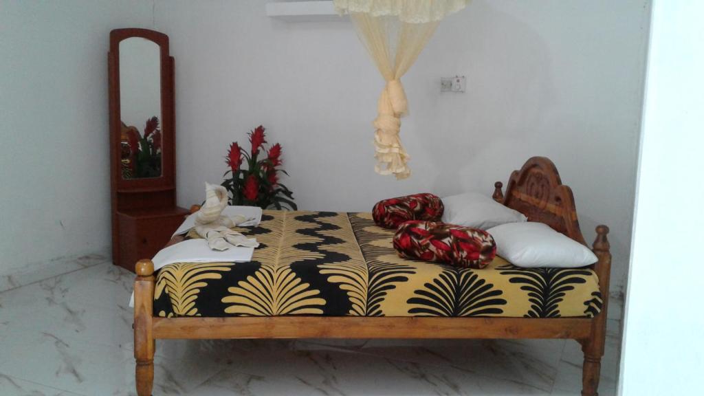 Postel nebo postele na pokoji v ubytování Kalana Homestay