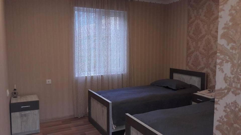 Postel nebo postele na pokoji v ubytování Maxvshi