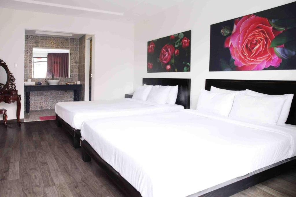 Postel nebo postele na pokoji v ubytování Thanh Binh 2 Hotel