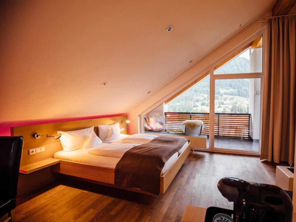 Krevet ili kreveti u jedinici u okviru objekta Genuss- & Aktivhotel Sonnenburg