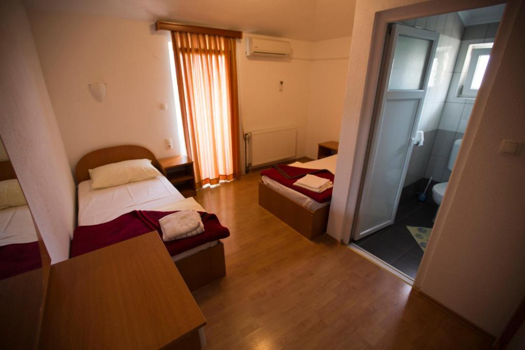 Ein Bett oder Betten in einem Zimmer der Unterkunft Guesthouse Mts