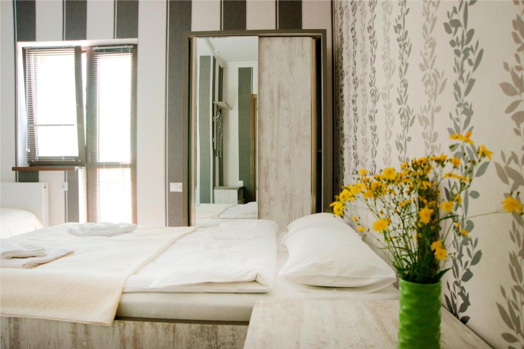 Postel nebo postele na pokoji v ubytování OISHE Boutique Hotel