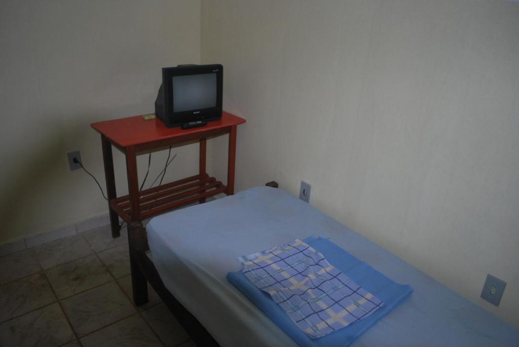 A television and/or entertainment centre at Hotel Palmas Tocantins