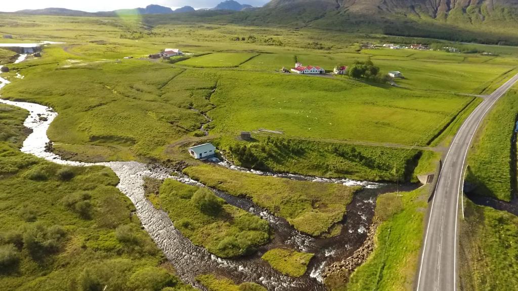 an aerial view of a road and a river at Eyvindartunga farm cottage in Laugarvatn