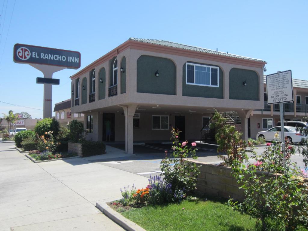 a building with a street sign in front of it at El Rancho Inn in Hawthorne