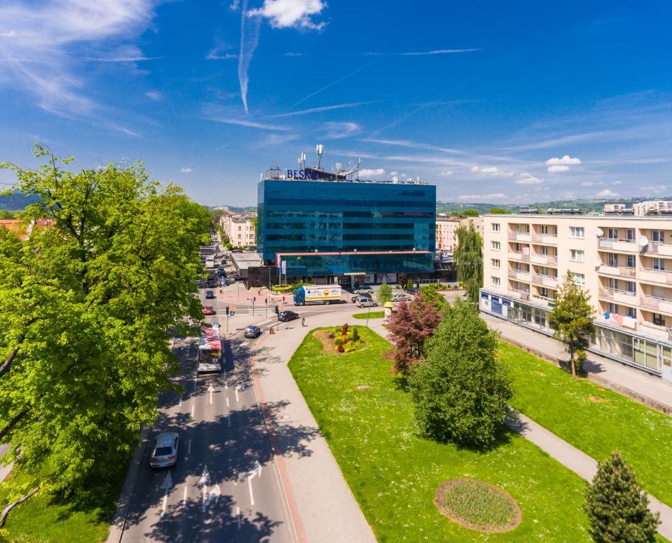 an aerial view of a city with a building at Hotel Beskid in Nowy Sącz