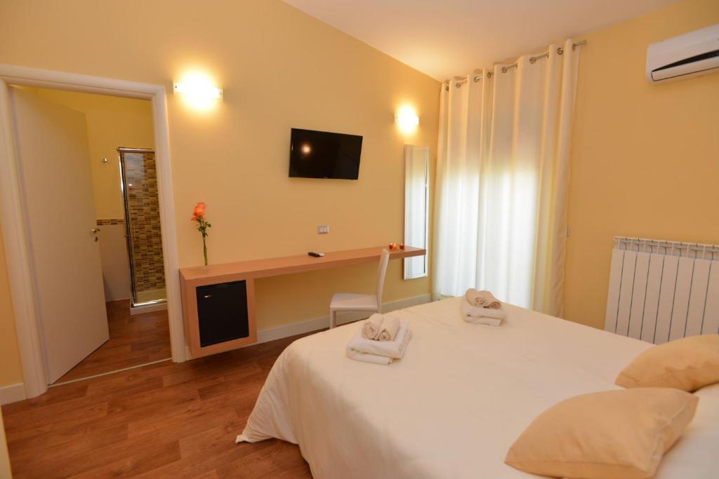 Postel nebo postele na pokoji v ubytování B&B Portacastello