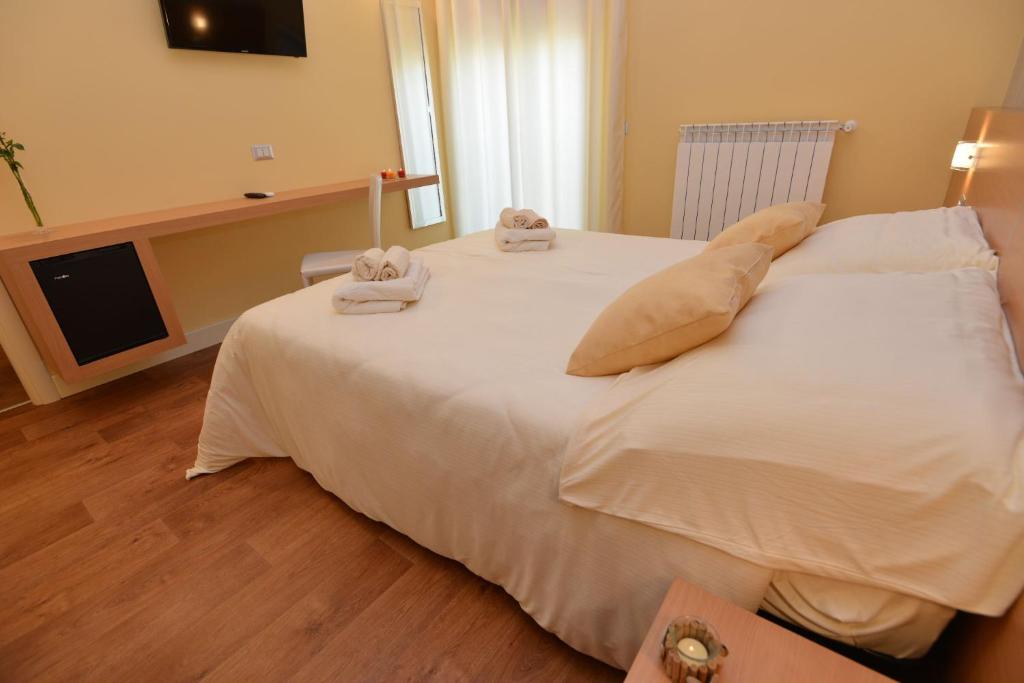 Postel nebo postele na pokoji v ubytování B&B Portacastello