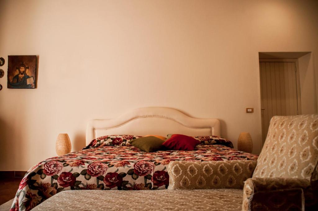 Łóżko lub łóżka w pokoju w obiekcie B&B La Villa