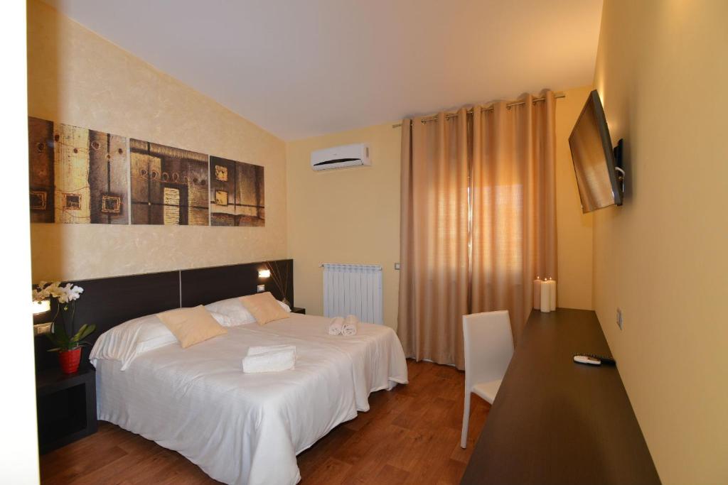 Postel nebo postele na pokoji v ubytování B&B Portacastello