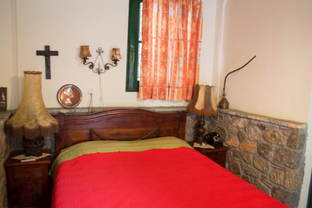 Postel nebo postele na pokoji v ubytování Alexandros Pension