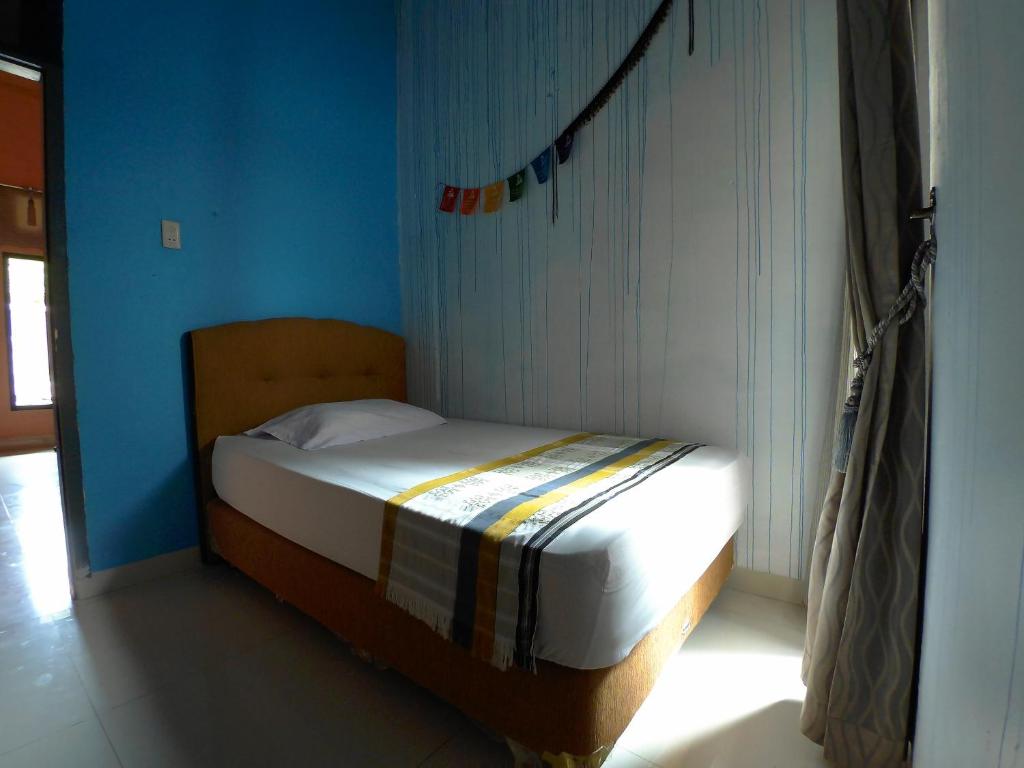 Postel nebo postele na pokoji v ubytování Eddie's Homestay